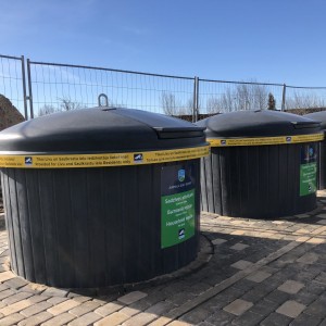 Semi underground waste collection container